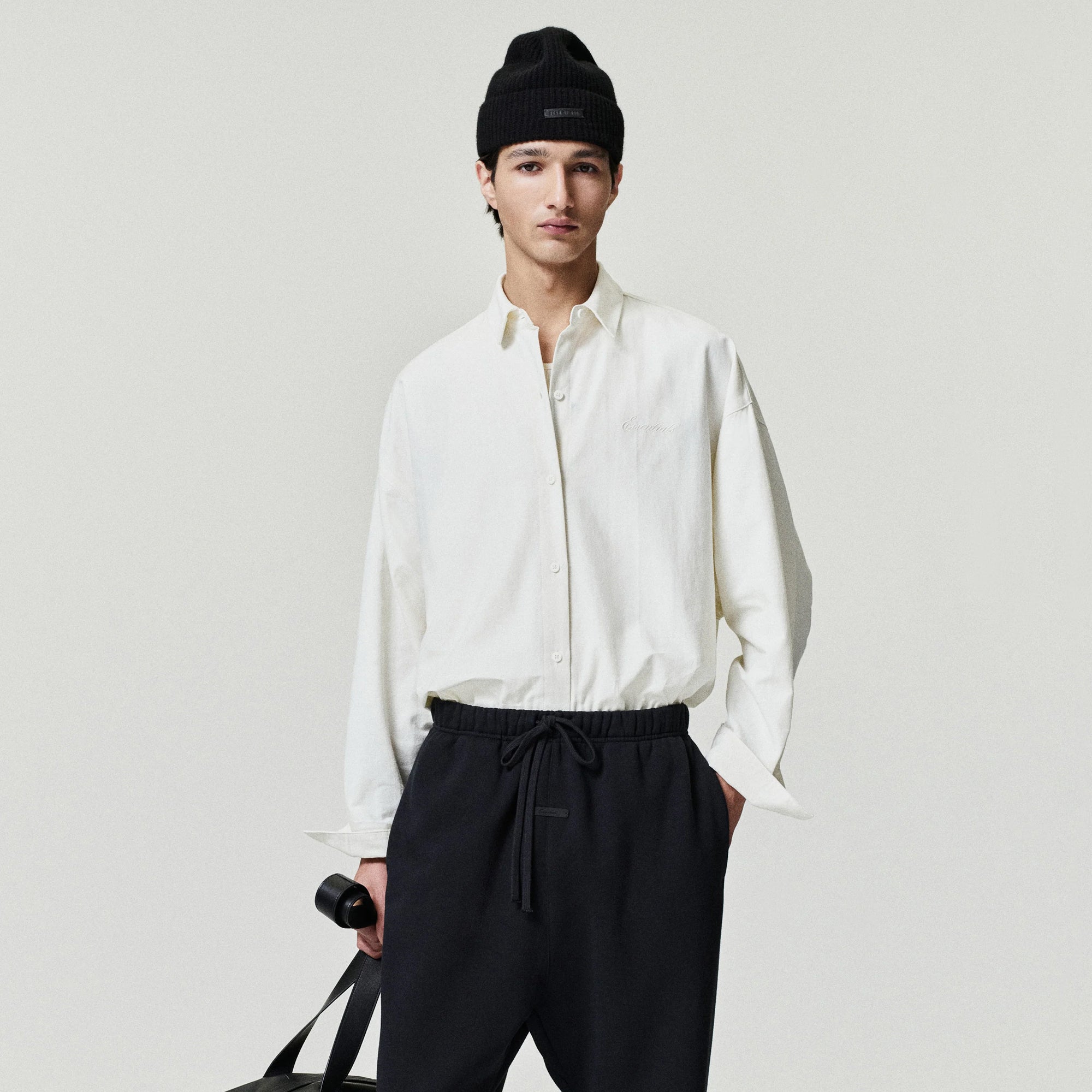 person wearing an Ivory Button Up Shirt on a white background