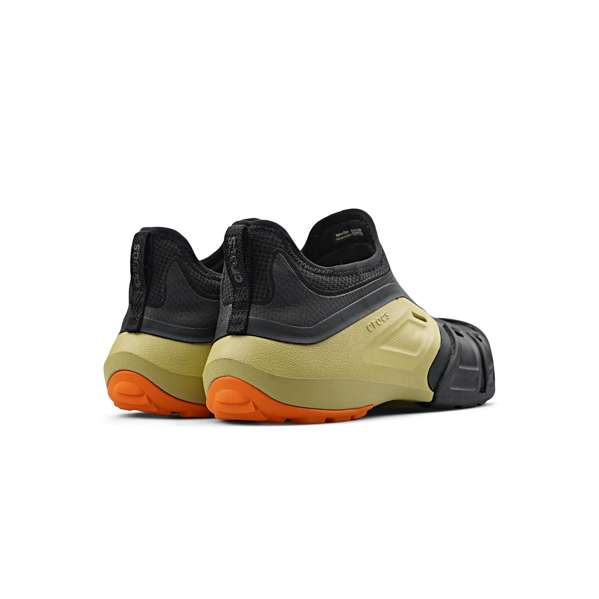 black green and orange mid sneaker clogs on a white background