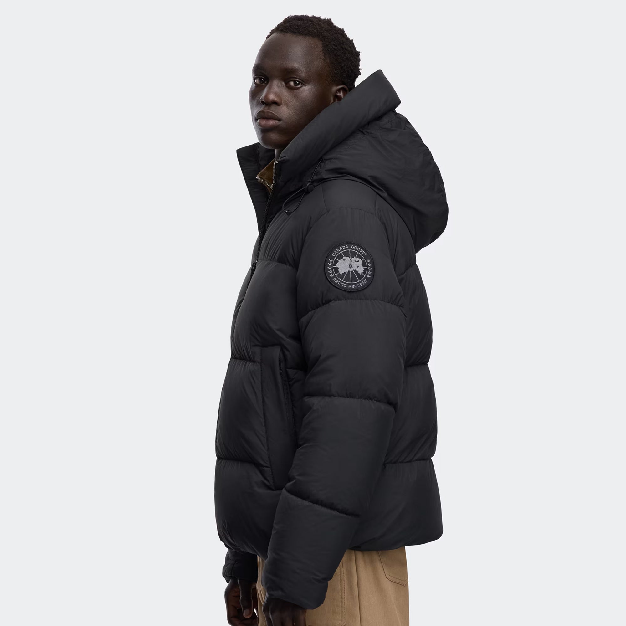 person wearing black jacket on a white background
