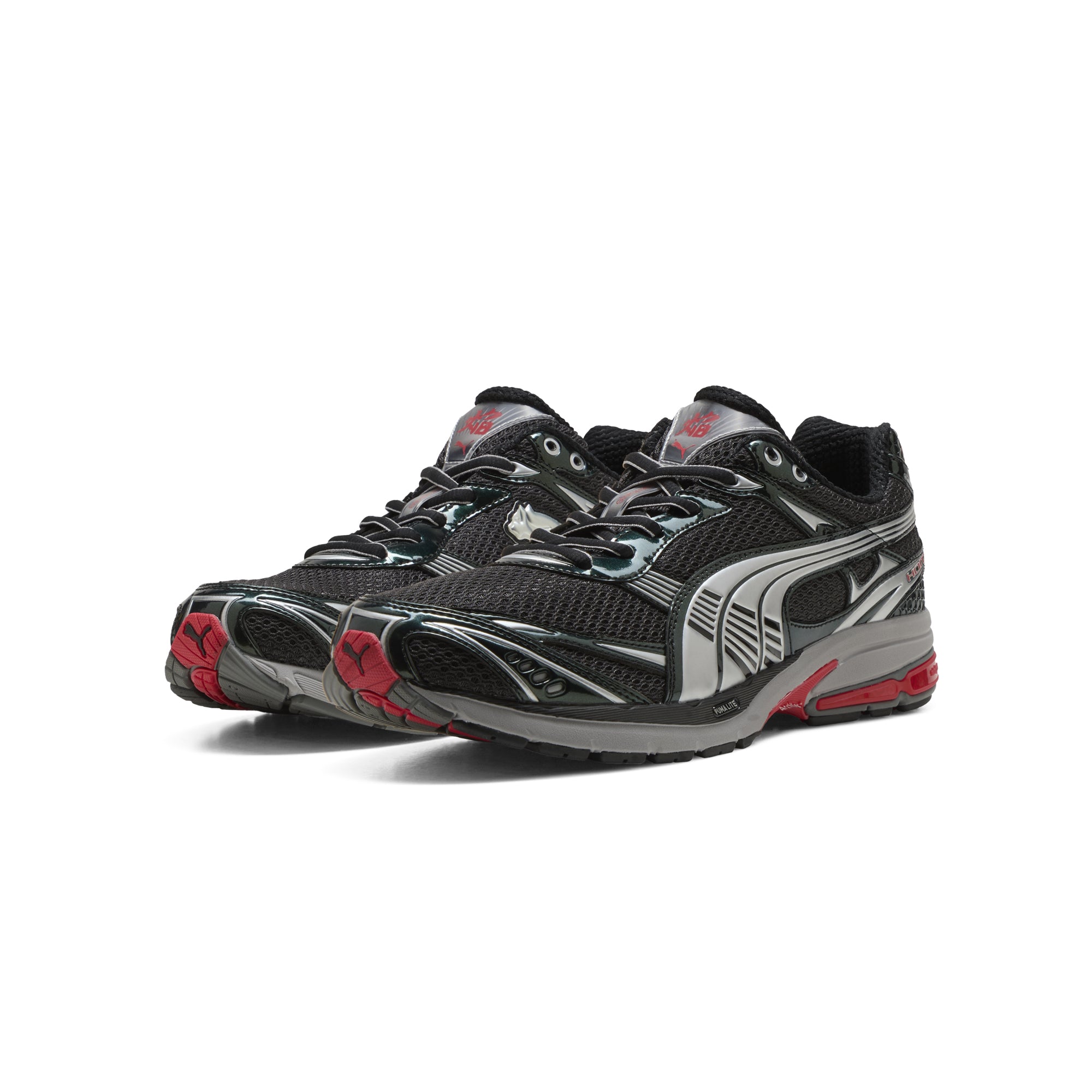 black silver red sneakers on a white background