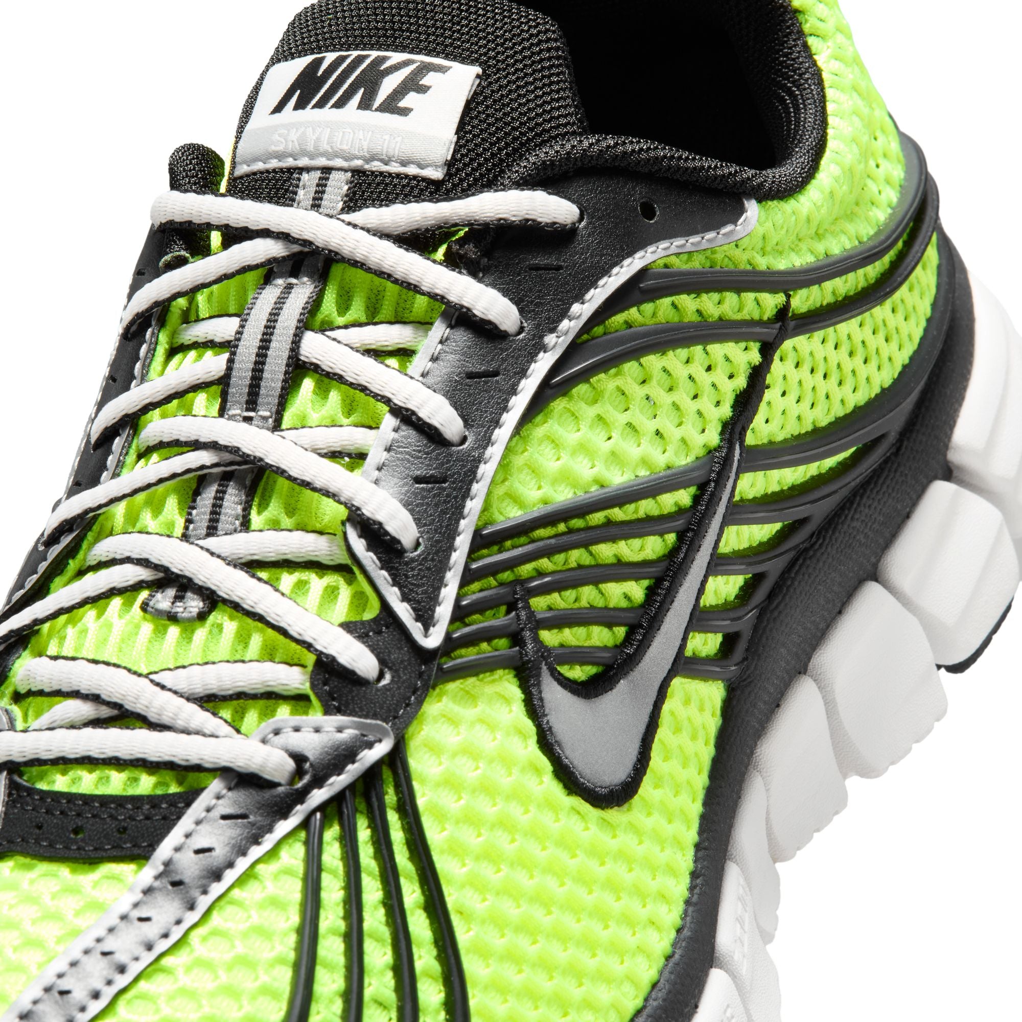 Volt green black and white sneakers on a white background