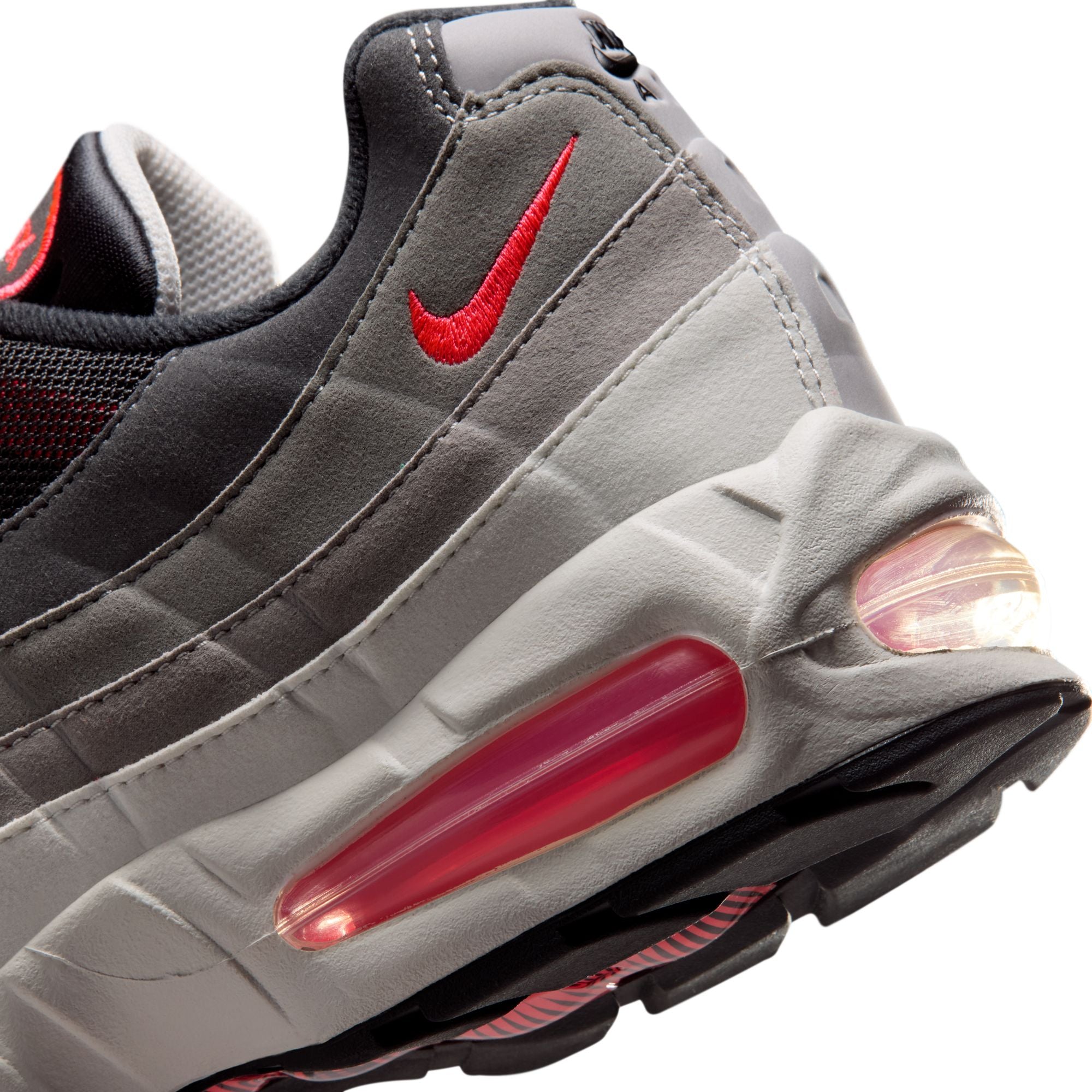 solar red, grey, black and white sneakers on a white background