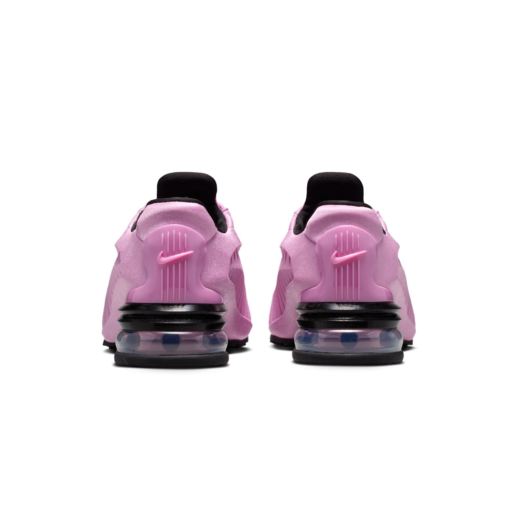 pink and black sneakers on a white background