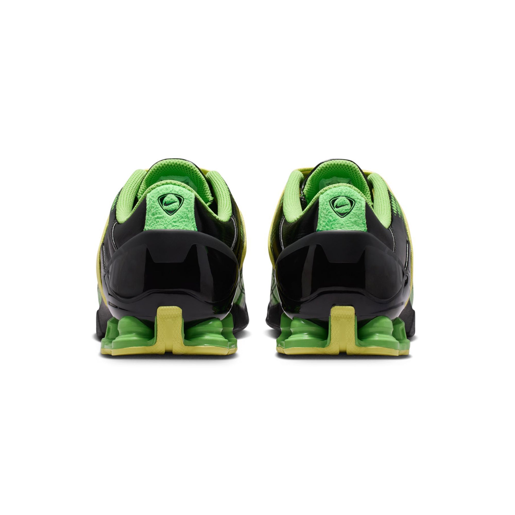 black green and yellow sneakers on a white background