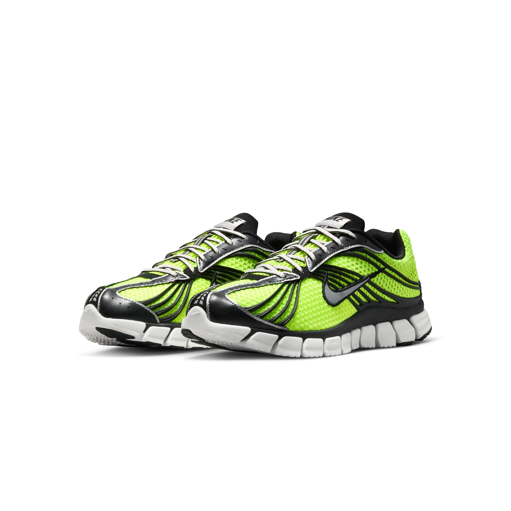 Volt green black and white sneakers on a white background