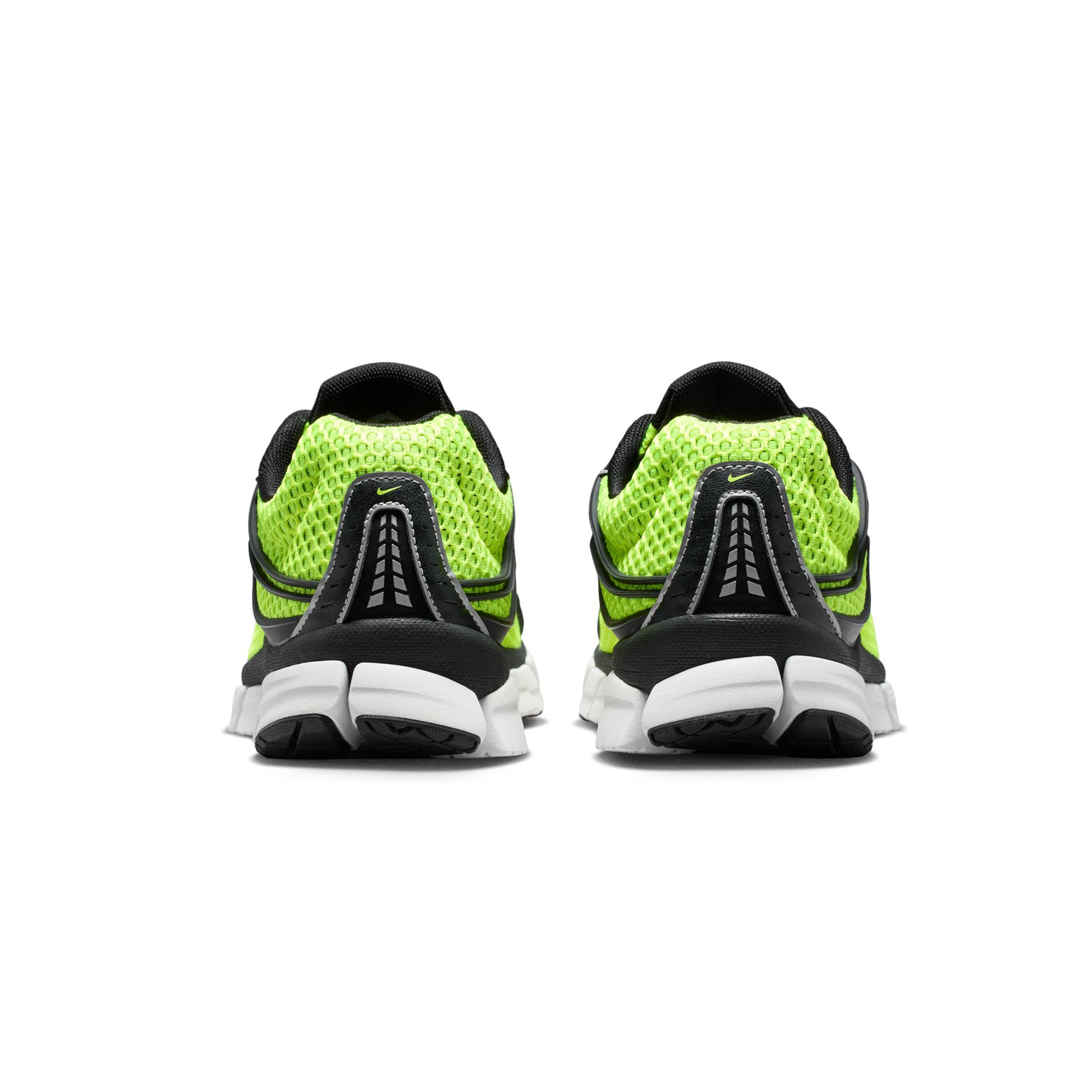 Volt green black and white sneakers on a white background
