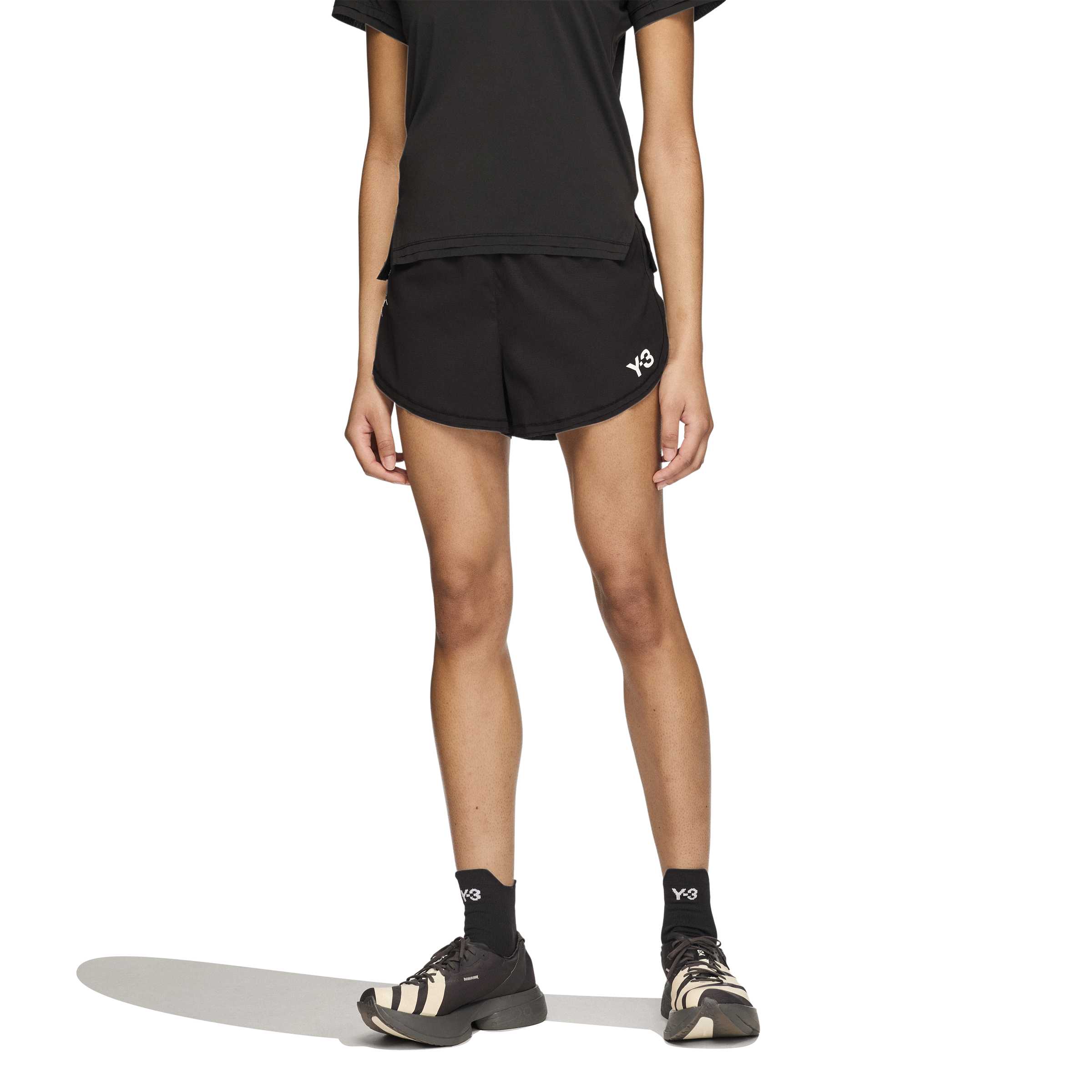 person wearing a black and white shorts on a white background
