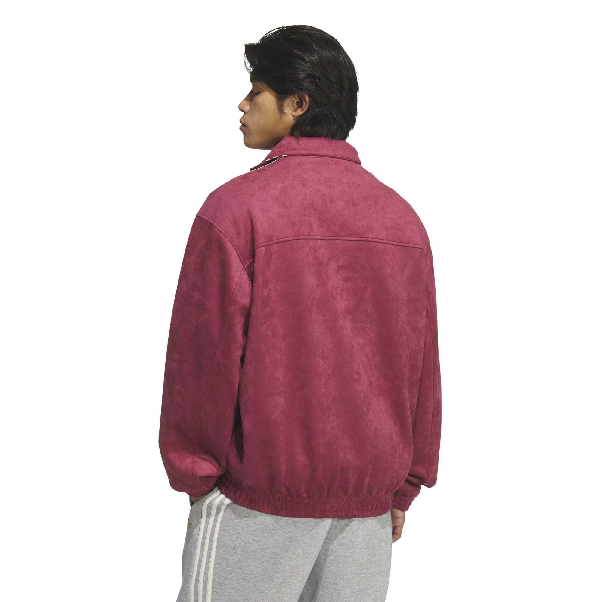 Person wearing burgundy and grey Jacket on a white background