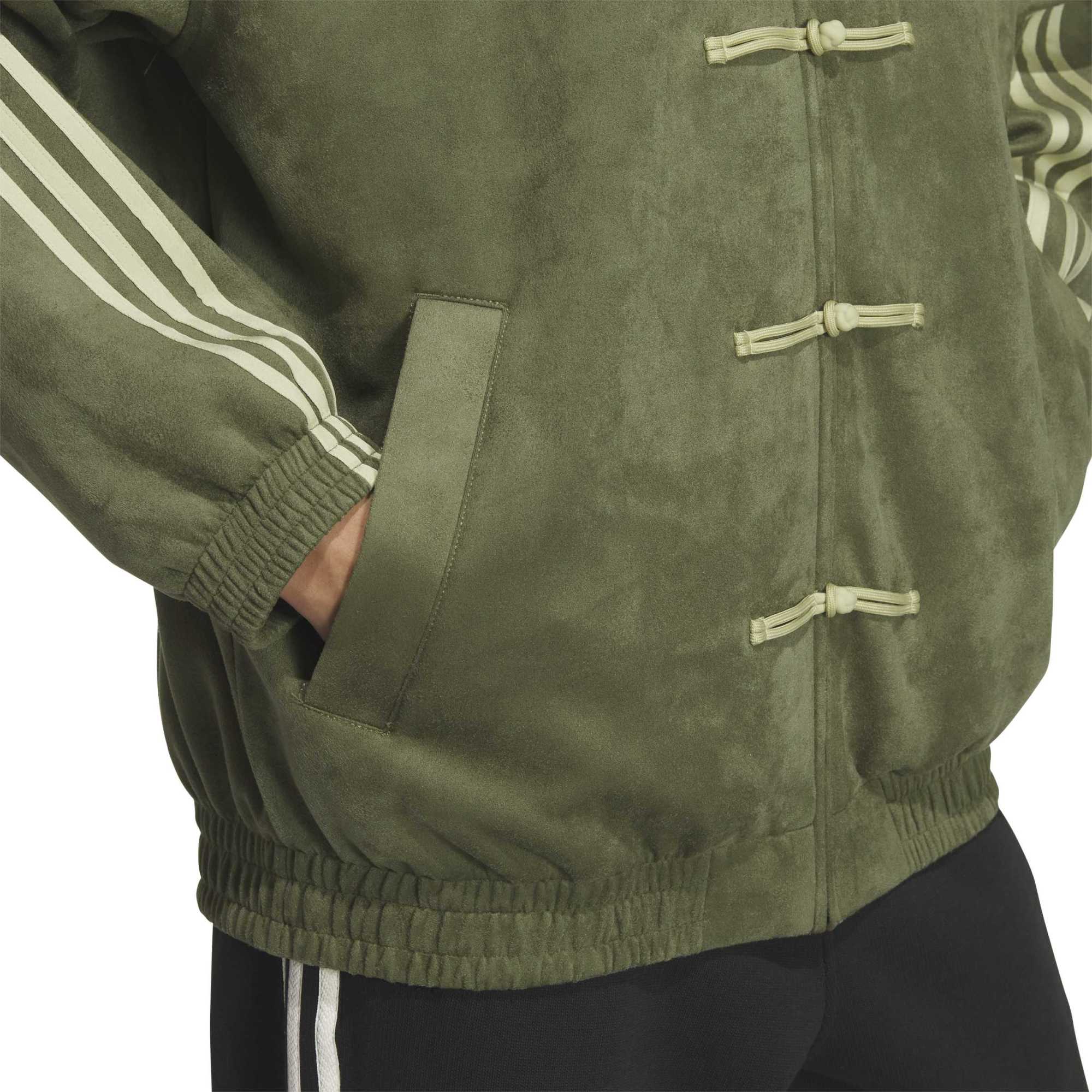 person wearing olive jacket on a white background