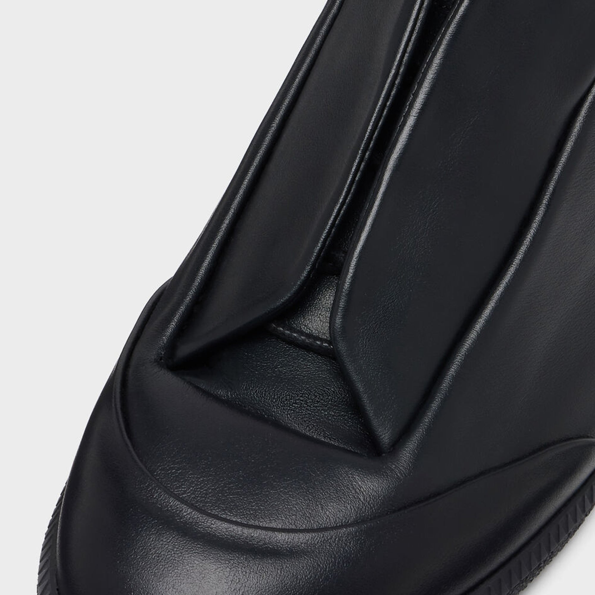 black sneakers on a white background