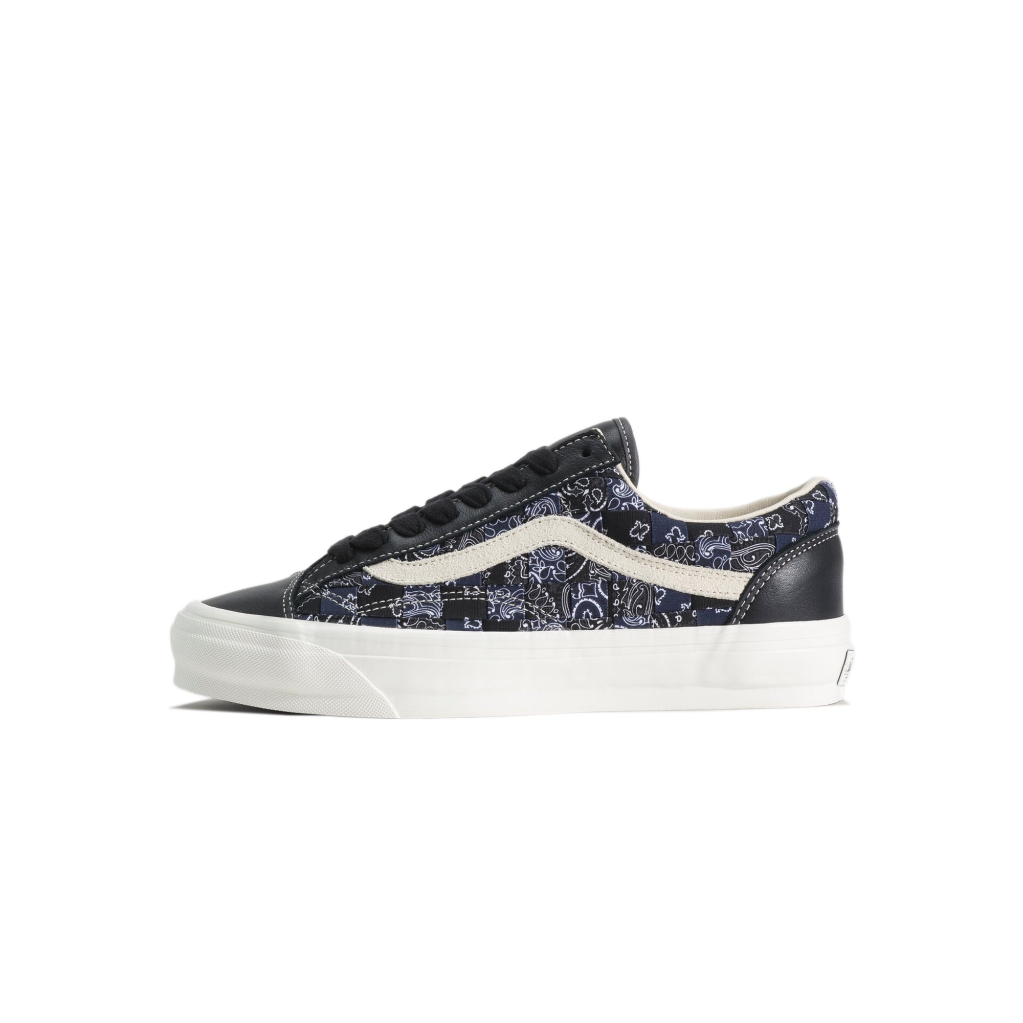 black white and blue sneakers on a white background