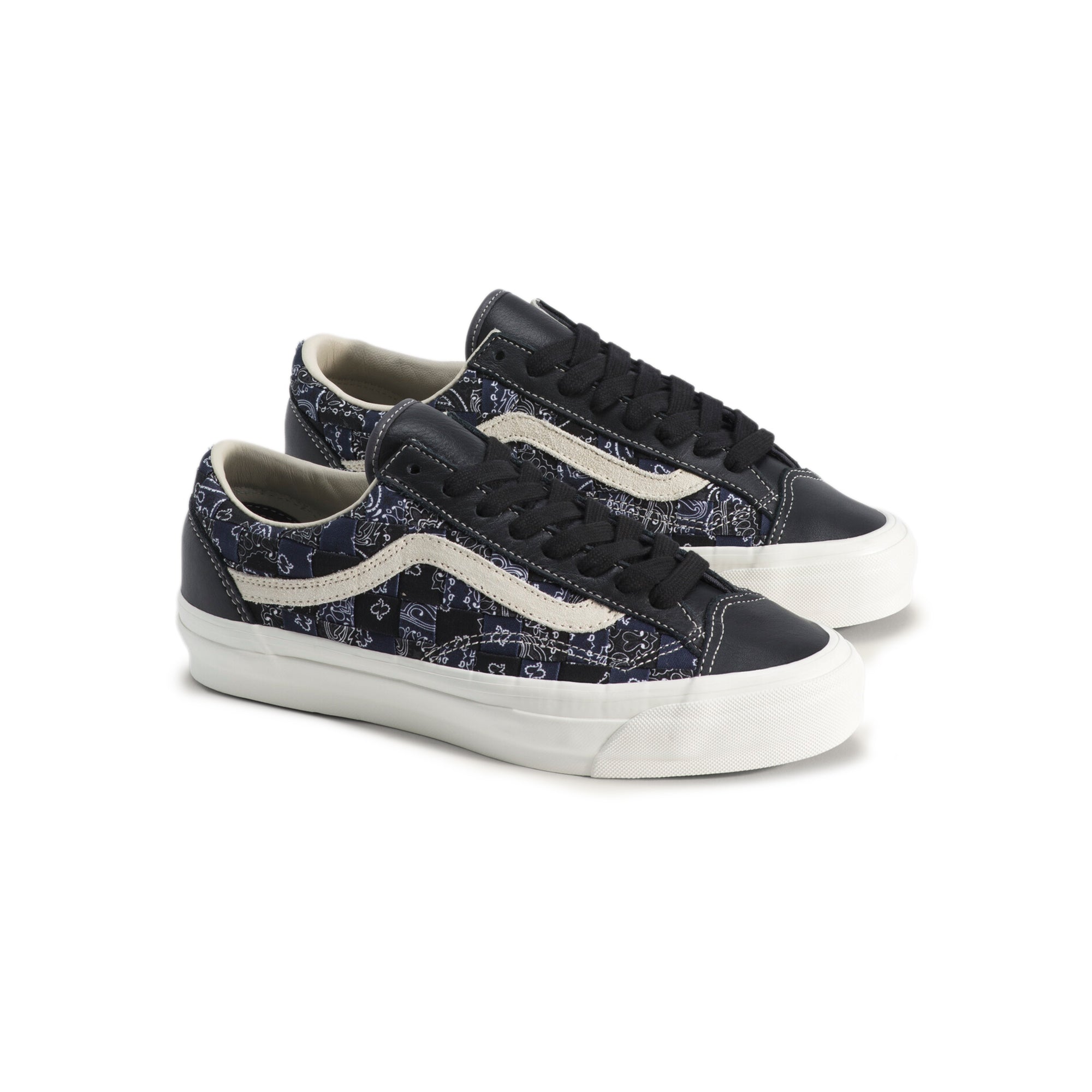 black white and blue sneakers on a white background