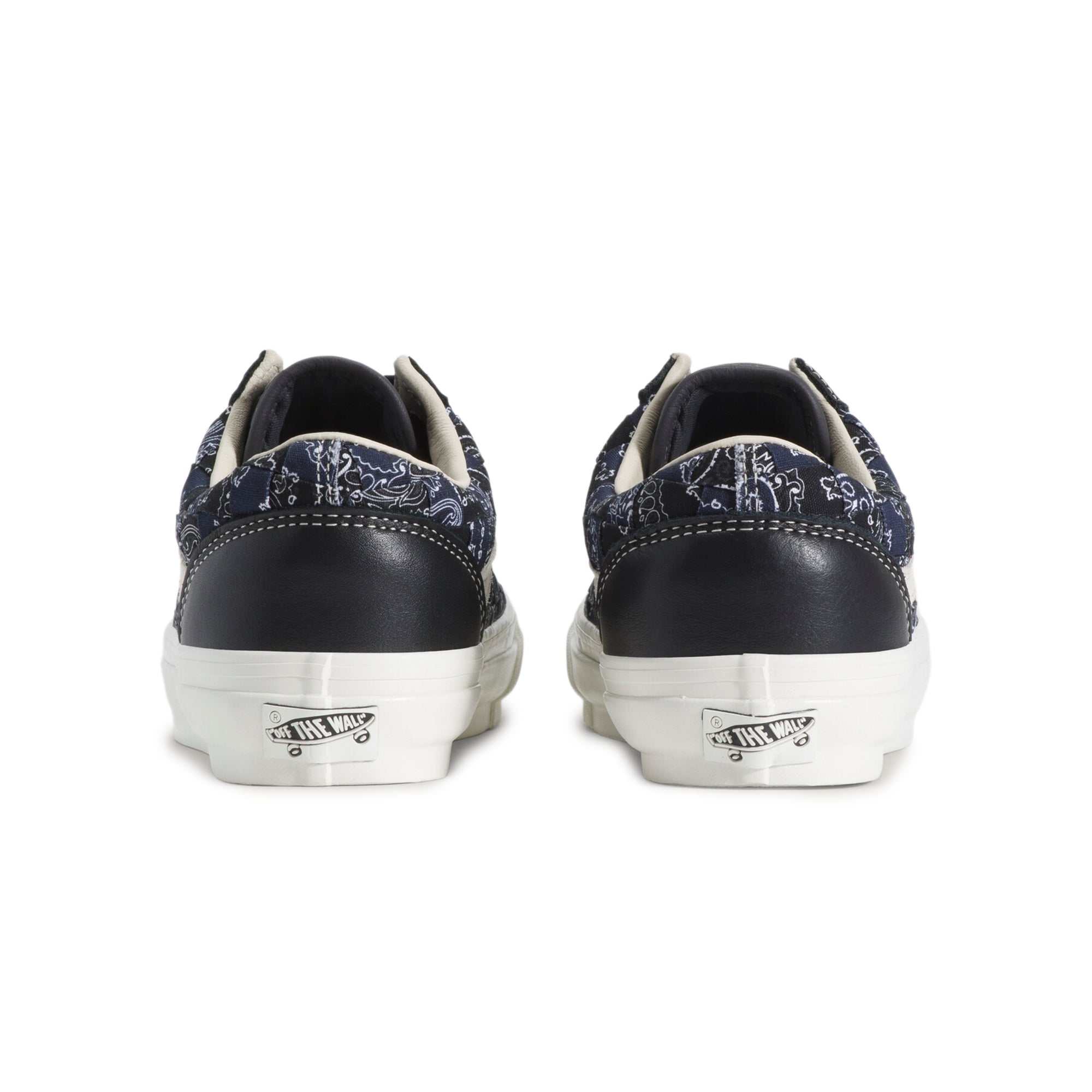black white and blue sneakers on a white background