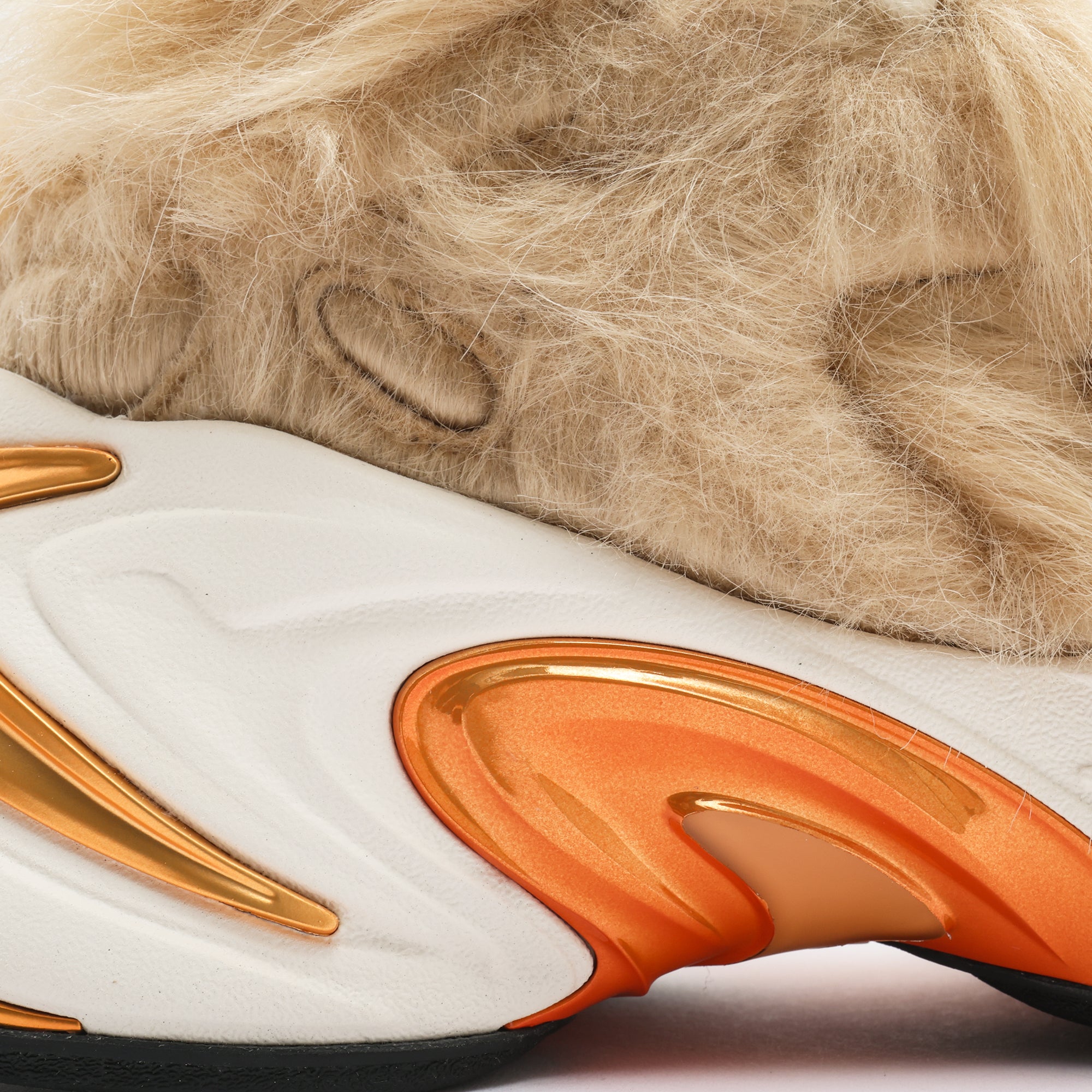 tan fur white and orange sneaker detail